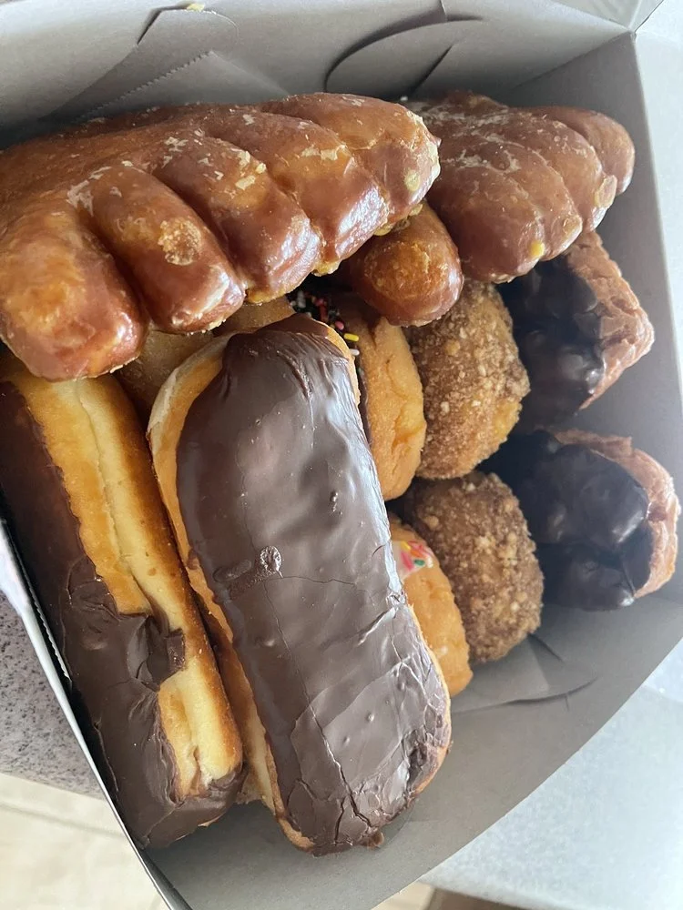 A box of assorted Friendly Donut House donuts